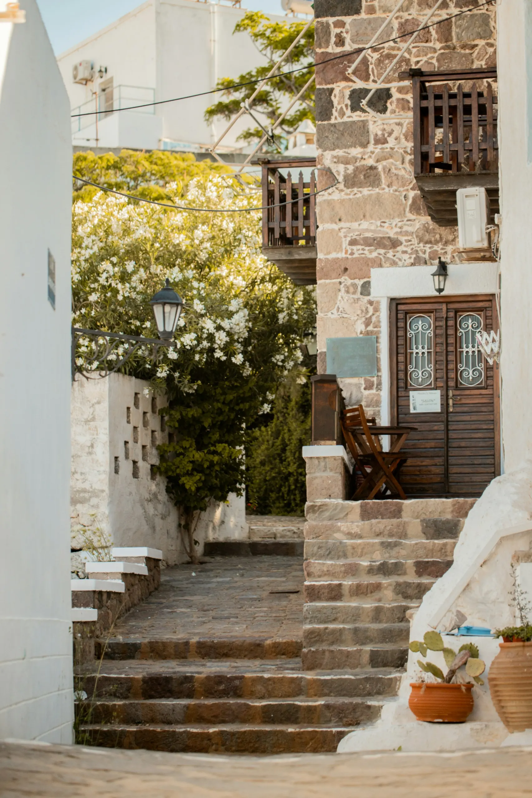 Stone alley with flowers in a Cycladic village